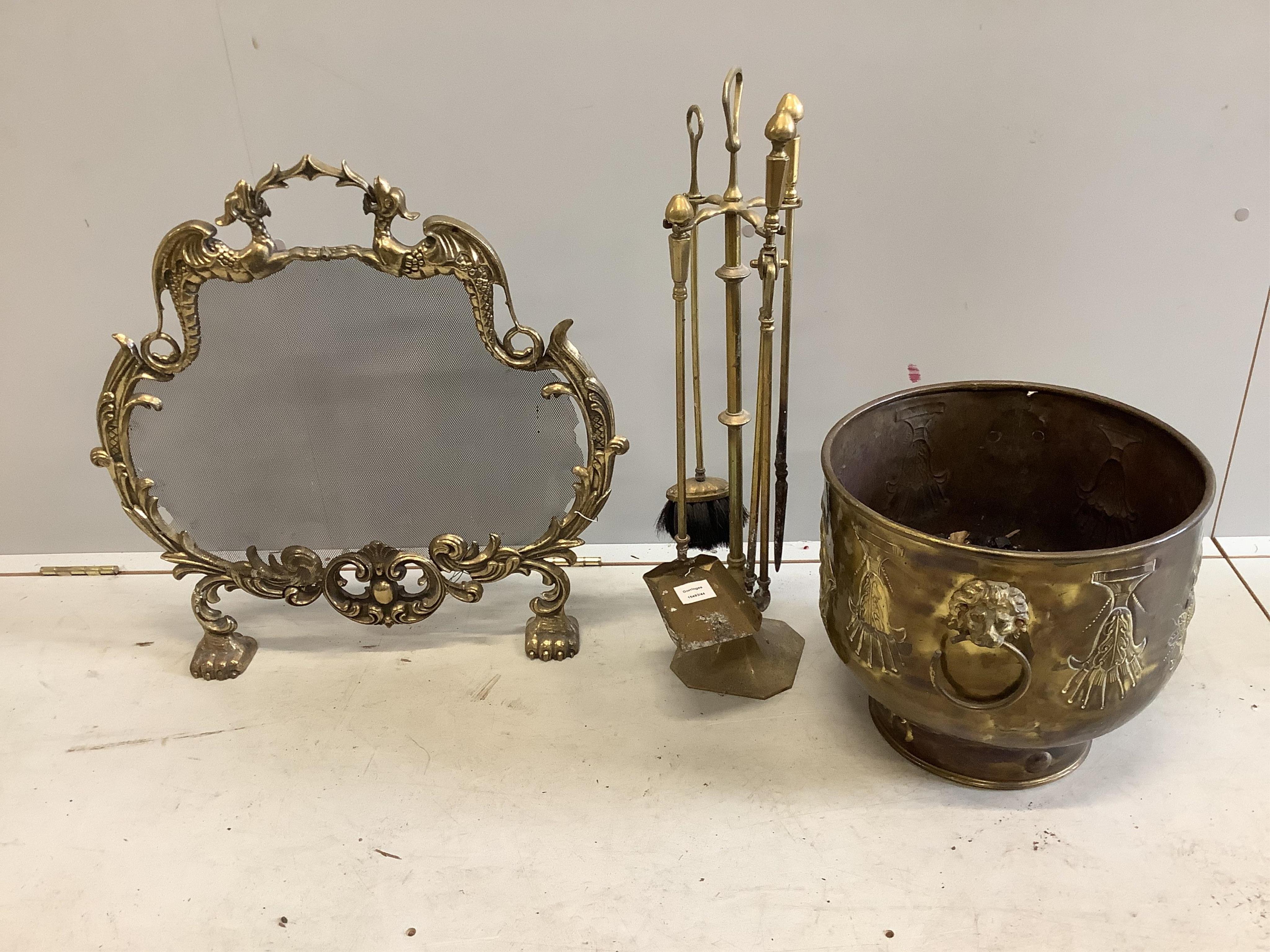 A Louis XV style gilt brass cartouche shaped spark guard, an embossed brass coal box and brass companion set. Condition - fair